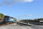 Tri-Rail Train # P663 is about to cross NW 25th Street at grade before finishing its journey at Miami Airport(Miami Intermodal Center Station). F40PH-3C # 811 is the power for the train.